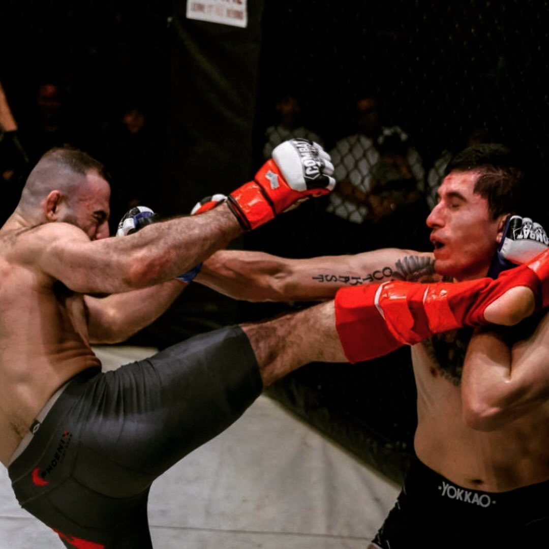 Kick exchange mid-fight