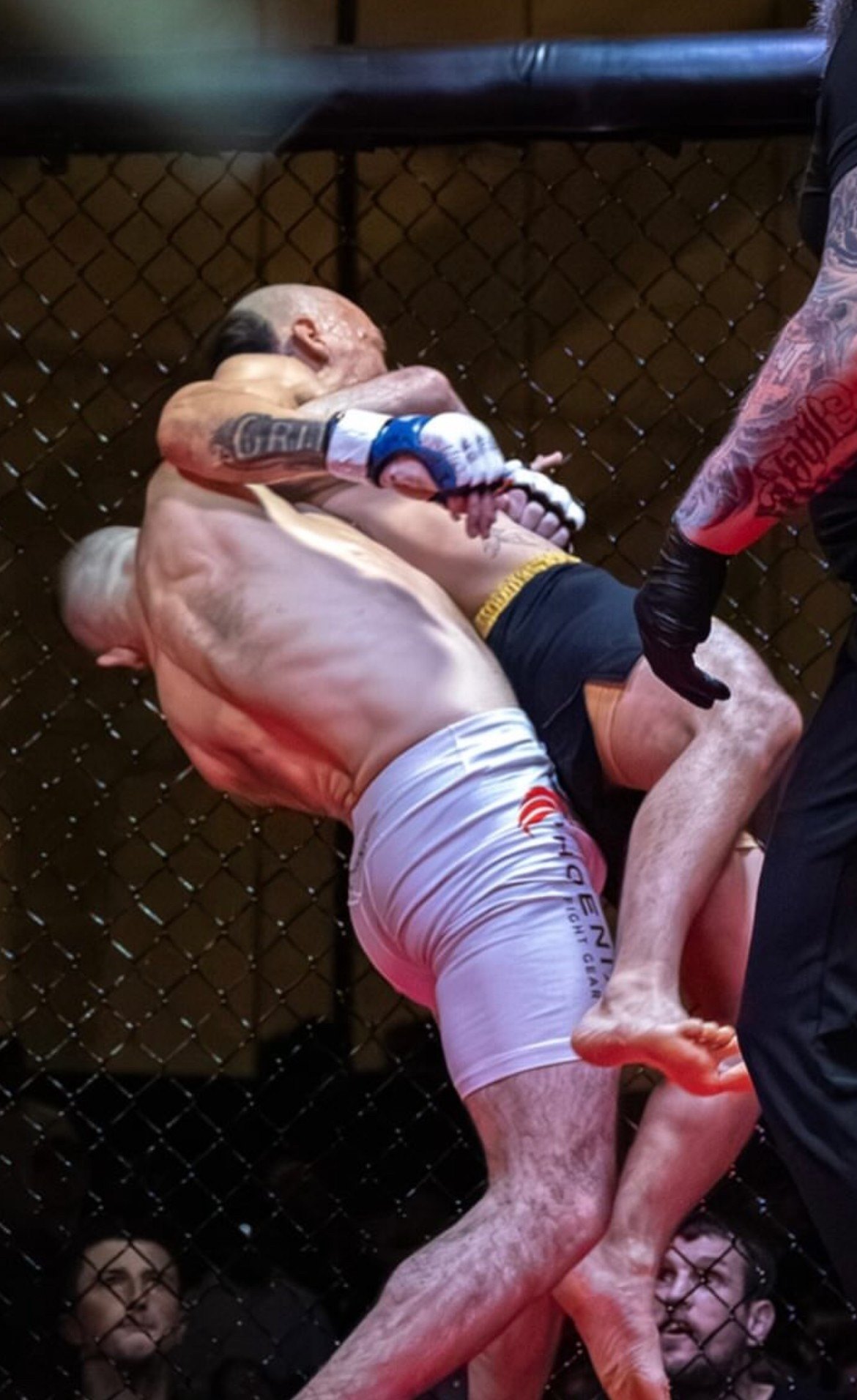 Michael Davtyan lifting his opponent off the mat