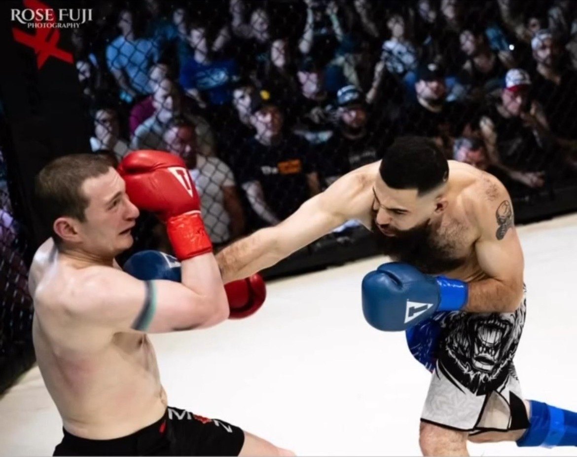 Michael Davtyan landing a punch, photo by Rose Fuji Photography